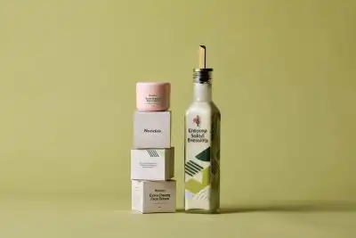 Nando's Extra creamy face cream stacked on packaging next to  Creamy Salad Dressing